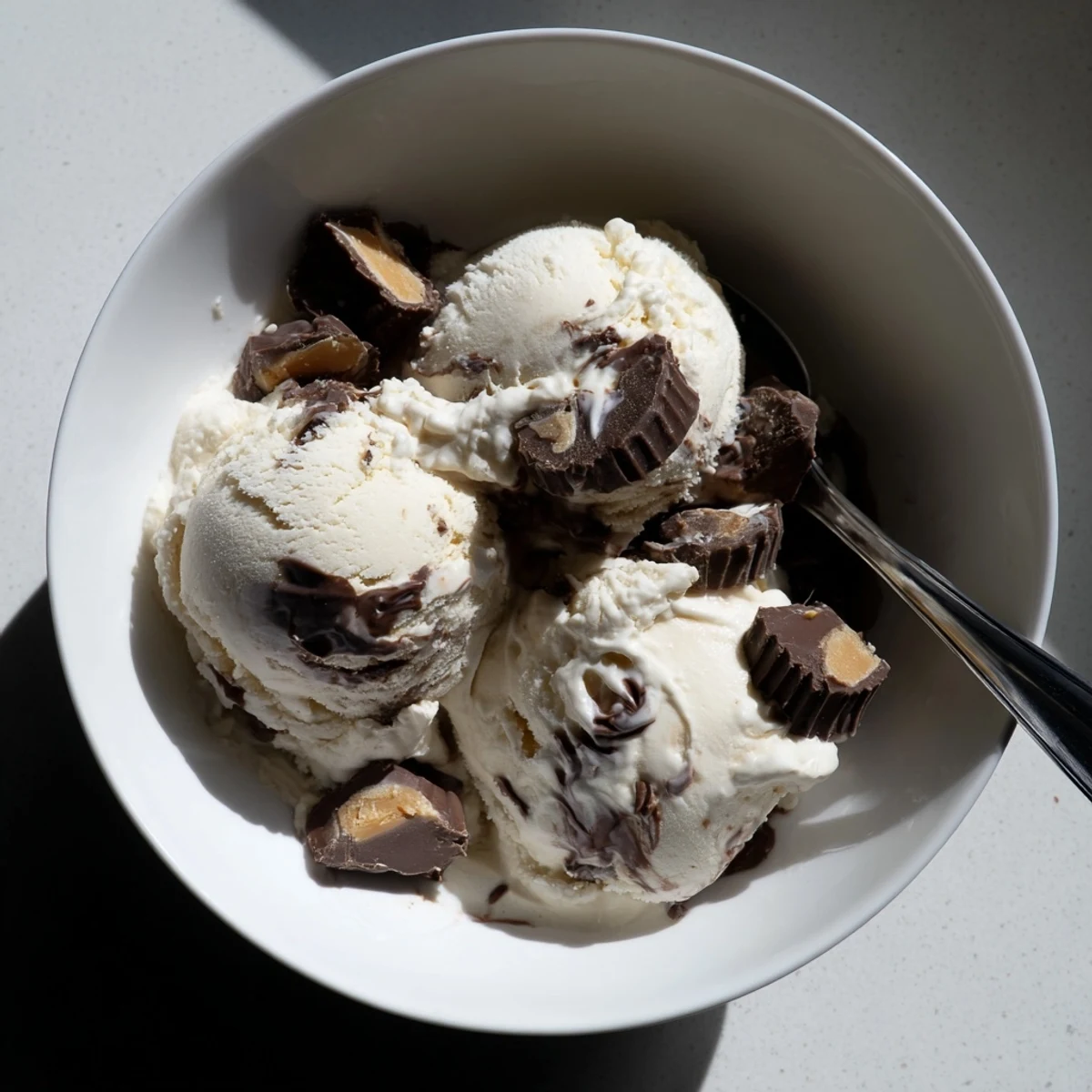 Creamy homemade Moose Tracks ice cream with fudge ribbons and peanut butter cups