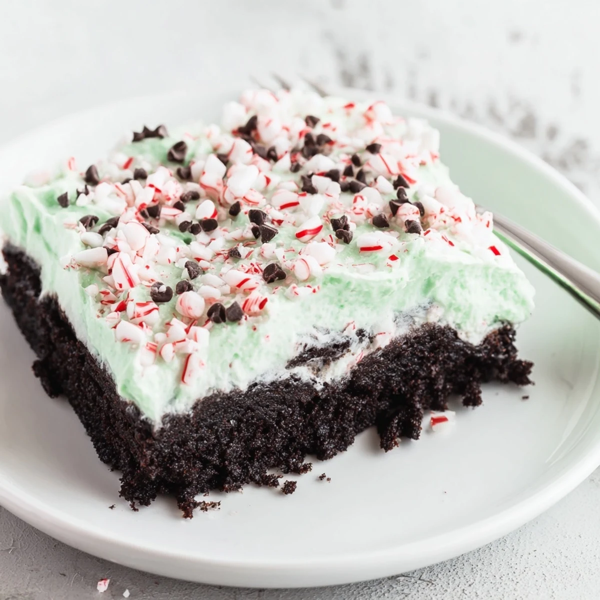 Creamy peppermint pudding filling in Peppermint Poke Cake, chilled and festive.
